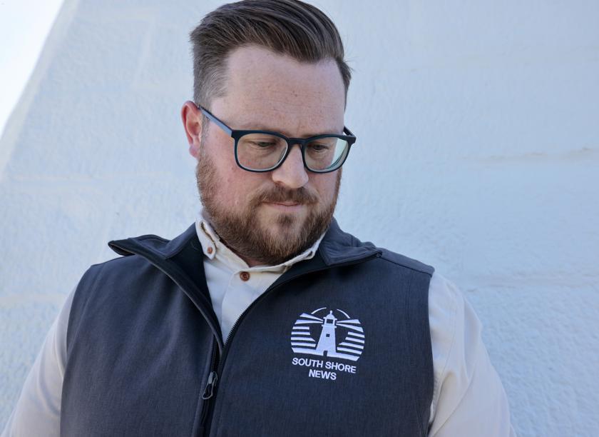 South Shore News lighthouse logo on embroidered vest